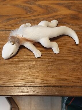 Handcrafted White Ceramic Lizard Figurine with Feather Accent